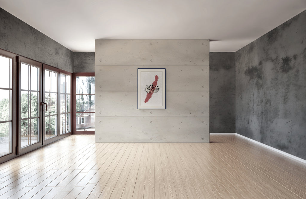 Absence — الغياب in a dark frame on a raw plaster wall in a rustic interior | ENJZ