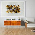 Prayer (صلاة) by Zein Sourany in a blue frame above a gold cane sofa. Limited edition Arabic poetry print on Hahnemühle paper. ENJZ.