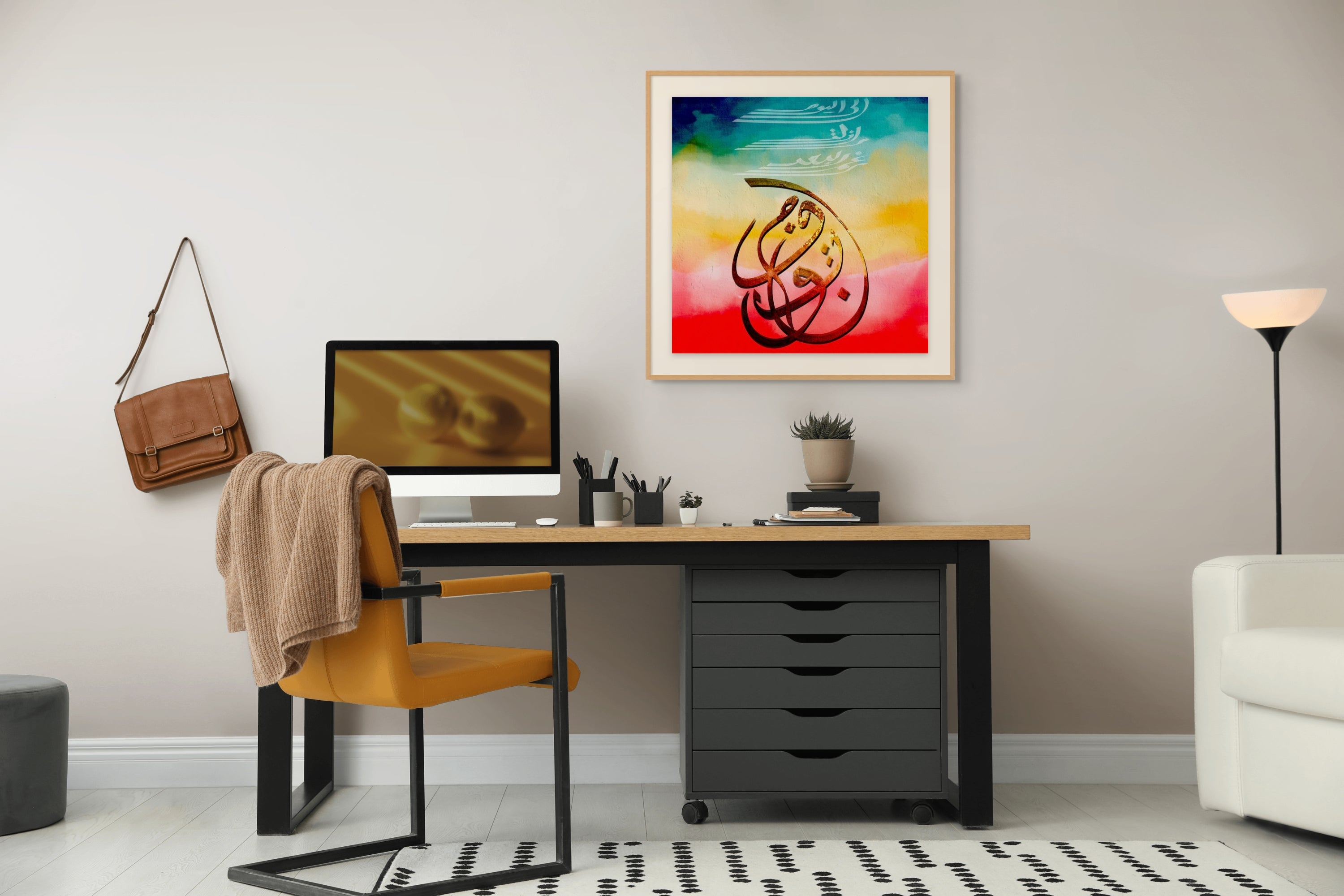 "Vision" ENJZ giclée print in a natural wood frame with white mat, displayed above a modern desk in a minimal home office — limited edition Arabic fine art print